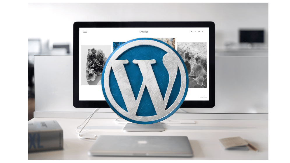 Lär dig WordPress. En datorskärm med WordPress symbol på.