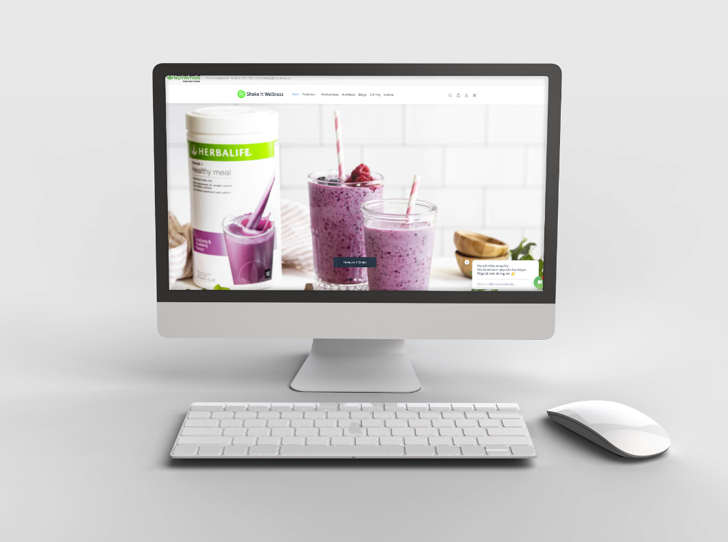 En bild på en dator mot grå bakgrund med Shake it Wellness hemsida på som Lean Designs har gjort